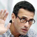 Venezuelan opposition leader Henrique Capriles talks to the media during a news conference in Caracas