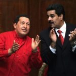 Venezuelan President Hugo Chavez (L) and