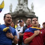 Venezuelans living in Mexico take part in a protest to demand a referendum to remove Venezuela’s President Nicolas Maduro at Angel de la Independencia monument in Mexico City