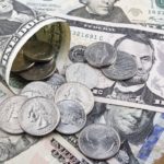 US Dollars coins and banknotes.