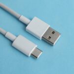 USB cable type C over blue background