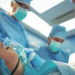 Team of surgeons performing operation in operation theater at hospital