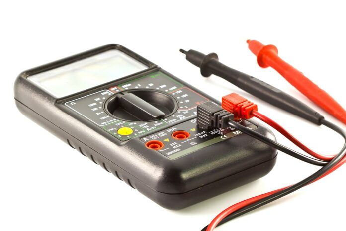 Old Digital multimeter isolated on white background